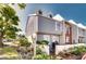 Gray two-story townhome with white trim and landscaping at 744 Cadiz Rd # 1, Venice, FL 34285