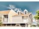 Two-story townhome with dormer windows and balcony at 744 Cadiz Rd # 1, Venice, FL 34285