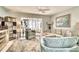 Bright living room with comfy seating, large windows, and stylish decor at 744 Cadiz Rd # 1, Venice, FL 34285