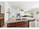 Kitchen island with double sink, granite top, and dishwasher at 8123 Rothbury Hills Pl, Gibsonton, FL 33534