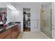 Elegant bathroom with granite countertops and a walk-in shower at 8424 Alberata Vista Dr, Tampa, FL 33647