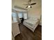 Spacious bedroom with a king-size bed and built-in drawers at 8424 Alberata Vista Dr, Tampa, FL 33647