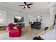 Relaxing living room with a large TV and comfortable seating at 8424 Alberata Vista Dr, Tampa, FL 33647