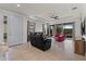 Spacious living room with tile floors and a view of the backyard at 8424 Alberata Vista Dr, Tampa, FL 33647