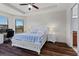 Bright main bedroom with a king-size bed and an office area at 8424 Alberata Vista Dr, Tampa, FL 33647