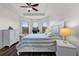 Spacious main bedroom with a king-size bed and ample natural light at 8424 Alberata Vista Dr, Tampa, FL 33647