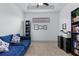 Home office with built-in shelving and comfortable sofa at 8424 Alberata Vista Dr, Tampa, FL 33647