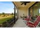 Spacious screened-in porch with outdoor seating and scenic backyard view at 8424 Alberata Vista Dr, Tampa, FL 33647