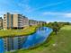 Aerial view of community featuring a pond and fountain, reflecting the building at 960 Starkey Rd # 7103, Largo, FL 33771