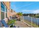 Inviting balcony view overlooking a serene lake, complete with comfortable seating and lush planters at 960 Starkey Rd # 7103, Largo, FL 33771