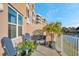 Balcony with chairs and plants, overlooking the water at 960 Starkey Rd # 7103, Largo, FL 33771