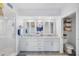 Beautiful bathroom featuring a double sink vanity, lots of counter space, and glass door shower at 960 Starkey Rd # 7103, Largo, FL 33771