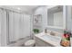 Well-lit bathroom with a shower/tub, vanity and sink, and decorative accents at 960 Starkey Rd # 7103, Largo, FL 33771