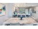 Dining area featuring a marble table, modern decor, and adjacent kitchen with bar seating at 960 Starkey Rd # 7103, Largo, FL 33771