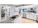 Modern kitchen with stainless appliances and adjacent living area with outside view at 960 Starkey Rd # 7103, Largo, FL 33771