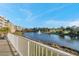 Scenic lake view from the balcony featuring a tranquil fountain and well-manicured green spaces at 960 Starkey Rd # 7103, Largo, FL 33771