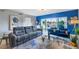 A living room showcasing a modern design and a view of the outdoor golf course from the patio at 960 Starkey Rd # 7103, Largo, FL 33771