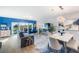 Cozy living room with dining area featuring golf course views through the sliding glass doors at 960 Starkey Rd # 7103, Largo, FL 33771