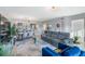 Spacious living room with hardwood floors, stylish furniture, modern lighting and open dining area at 960 Starkey Rd # 7103, Largo, FL 33771