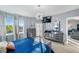 Bright and airy main bedroom with water views, balcony access, and modern lighting at 960 Starkey Rd # 7103, Largo, FL 33771