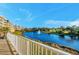 Scenic pond view with fountain from balcony of condominiums surrounded by mature trees at 960 Starkey Rd # 7103, Largo, FL 33771