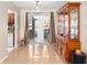 Dining area with wood china cabinet and access to kitchen at 9940 47Th N Ave # 120, St Petersburg, FL 33708