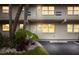 Exterior view of condo building showcasing landscaping and assigned parking at 9940 47Th N Ave # 120, St Petersburg, FL 33708