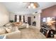Spacious living room with beige sectional sofa and large TV at 9940 47Th N Ave # 120, St Petersburg, FL 33708