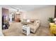 Bright living room with L-shaped sofa and access to dining area at 9940 47Th N Ave # 120, St Petersburg, FL 33708