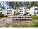 Community patio with picnic tables and fire pit at 9940 47Th N Ave # 120, St Petersburg, FL 33708