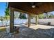 Covered patio with fire pit and ceiling fan at 10734 Moss Island Dr, Riverview, FL 33569