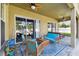 Relaxing covered patio with seating and a view of the pool at 10734 Moss Island Dr, Riverview, FL 33569