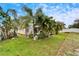 Relaxing pool area with lush landscaping and screened enclosure at 10735 Deepbrook Dr, Riverview, FL 33569