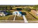 Single-story home with paved driveway and large backyard in a rural setting at 10920 Flint Estates Dr, Thonotosassa, FL 33592
