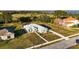 Aerial view of house, landscaping, and paved driveway at 10920 Flint Estates Dr, Thonotosassa, FL 33592