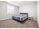 Comfortable bedroom with a bed, a window, carpeted floor, and a closet at 10920 Flint Estates Dr, Thonotosassa, FL 33592