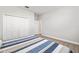 Bedroom featuring a bed, carpeted flooring, and a spacious closet at 10920 Flint Estates Dr, Thonotosassa, FL 33592