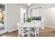 Cozy dining area featuring a white table and chairs with natural light from the door to the patio at 10920 Flint Estates Dr, Thonotosassa, FL 33592