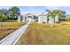 Single-story home with stone accents and a paved walkway at 10920 Flint Estates Dr, Thonotosassa, FL 33592