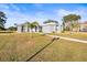Lovely home with stone accents, lush landscaping, and a neatly maintained front yard at 10920 Flint Estates Dr, Thonotosassa, FL 33592
