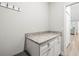 Hallway with extra counter and storage space and granite countertops at 10920 Flint Estates Dr, Thonotosassa, FL 33592