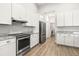 Modern kitchen features stainless steel appliances, granite countertops, and a spacious design at 10920 Flint Estates Dr, Thonotosassa, FL 33592