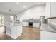 Bright kitchen boasts stainless steel appliances, granite countertops, and ample white cabinets at 10920 Flint Estates Dr, Thonotosassa, FL 33592
