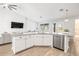 Stylish kitchen island with a stainless steel dishwasher and white cabinets at 10920 Flint Estates Dr, Thonotosassa, FL 33592