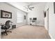 Office space featuring a modern desk, ceiling fan, and a view of the backyard at 10920 Flint Estates Dr, Thonotosassa, FL 33592