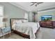 Spacious Primary bedroom with king-size bed and hardwood floors at 1108 92Nd Nw St, Bradenton, FL 34209