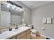 Updated bathroom with light wood cabinets at 11225 Scotchwood Dr, Riverview, FL 33579
