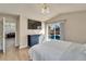 Main bedroom with pool view and large bed at 11225 Scotchwood Dr, Riverview, FL 33579