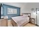 Bright bedroom with a double bed, light wood furniture, and a large window at 11225 Scotchwood Dr, Riverview, FL 33579