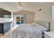 Main bedroom with pool view and large bed at 11225 Scotchwood Dr, Riverview, FL 33579